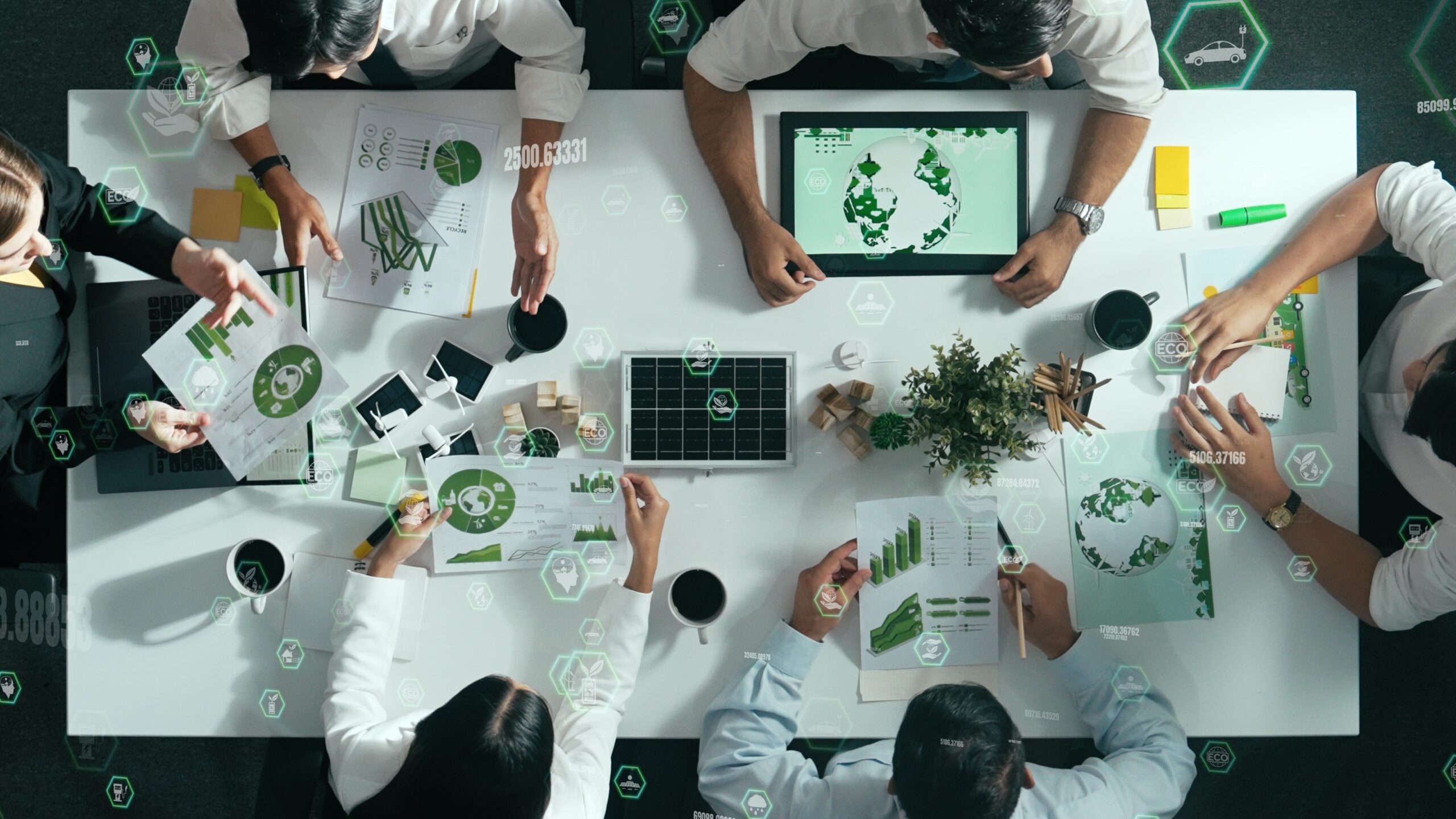 Top down view of business team discuss about using clean energy. Alimentation.